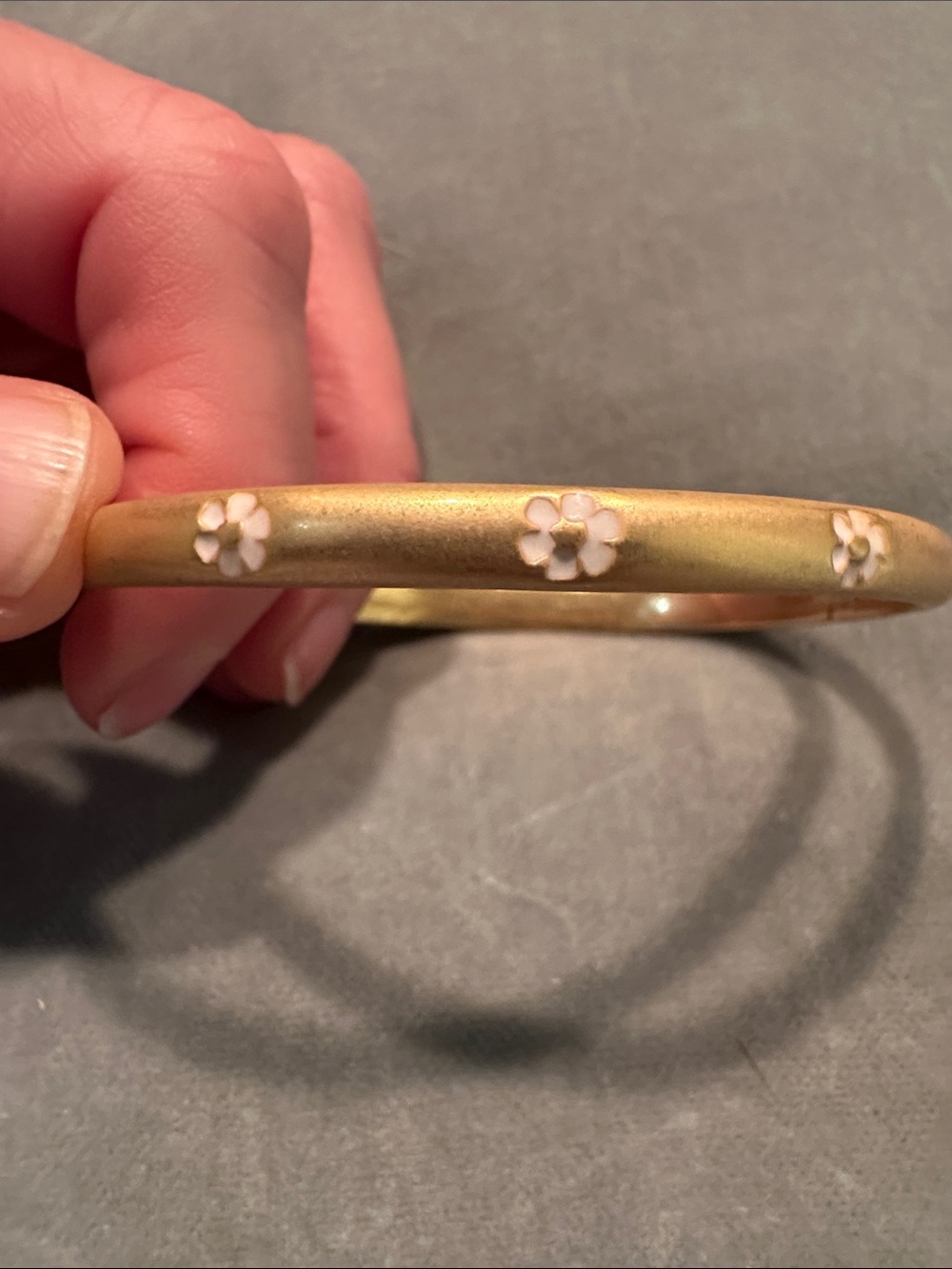 Gold Tone Bangle Bracelet with White Floral Accents